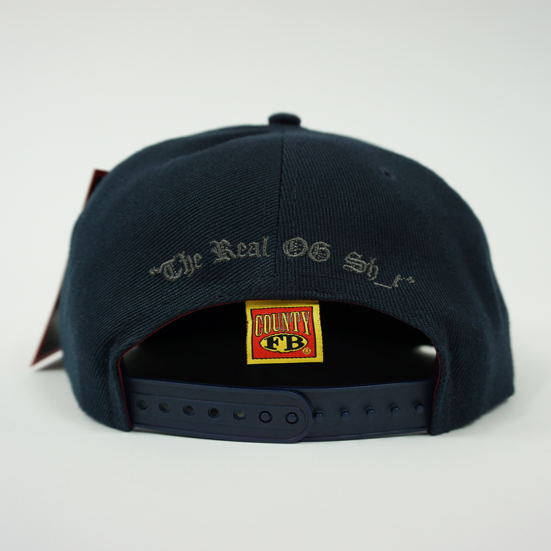 FB County Charlie Brown Cap/Hat Navy/Grey Back Side with Adjustable Strap. "The Real OG Sh_t" embroidered in Grey.